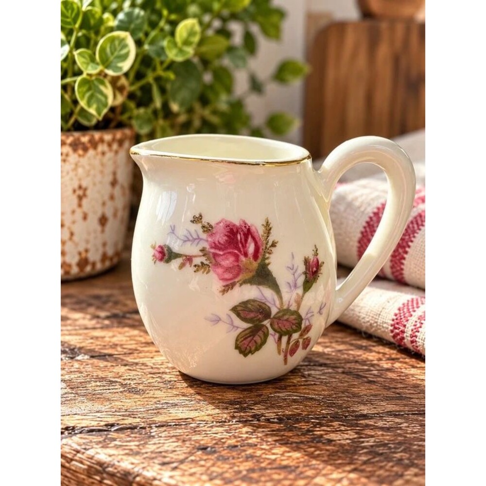 Floral creamer | almost 3 inches | both sides have flowers | 023